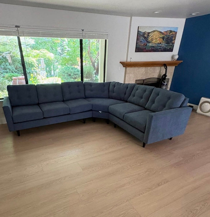 Flores Design Talmadge custom blue sectional sofa with rounded corner seating in a Sacramento living room.
