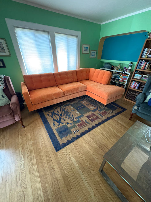 Custom Orange Talmadge sectional by Flores Design featuring blue fabric upholstery and curved corner configuration, available at Sacramento Furniture Store.