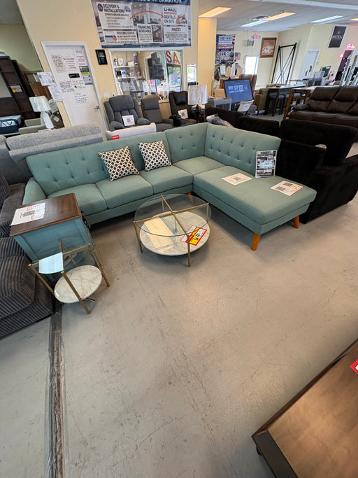 Laguna 111-inch mid-century modern sectional with tufted seating, tapered wood legs and right-facing chaise in aqua upholstery.