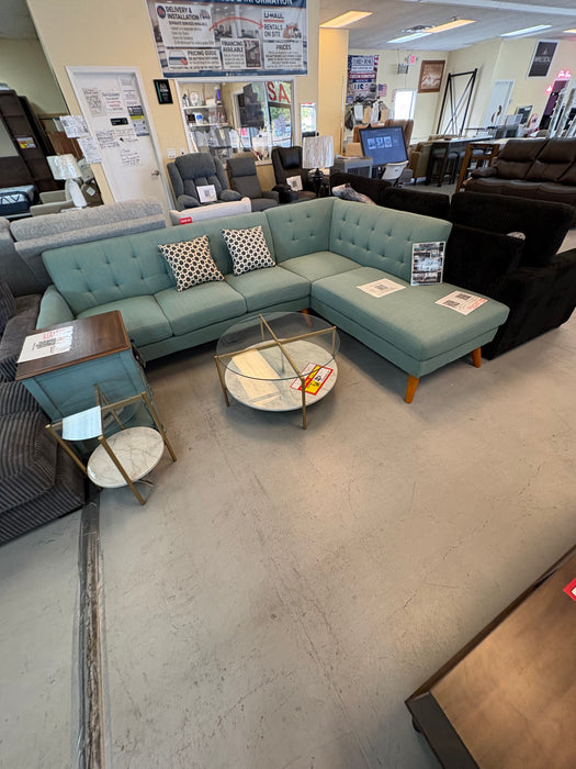Laguna 111-inch mid-century modern sectional with tufted seating, tapered wood legs and right-facing chaise in aqua upholstery.
