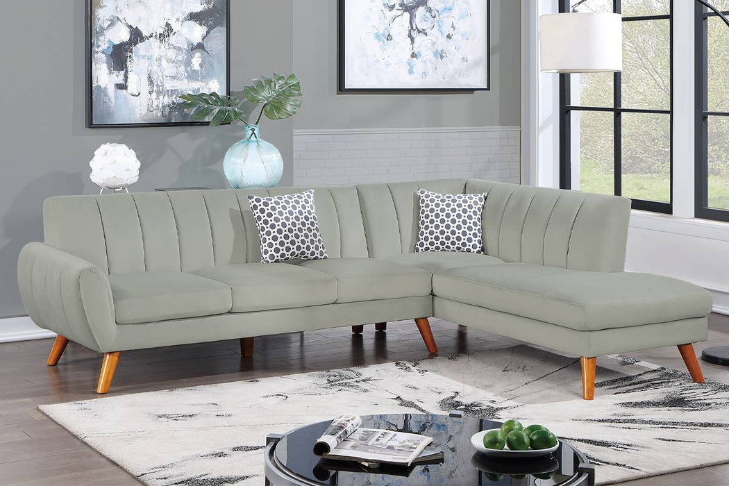 Light gray mid-century modern velvet sectional with right-facing chaise, channel tufting and wood legs at Sacramento Furniture Store.