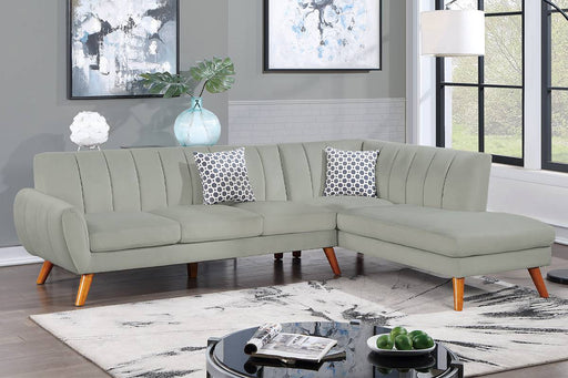 Light gray mid-century modern velvet sectional with right-facing chaise, channel tufting and wood legs at Sacramento Furniture Store.